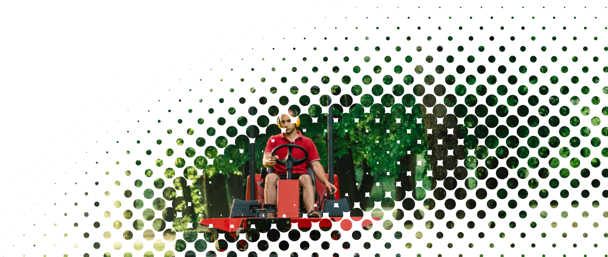 photo of a groundskeeper mowing