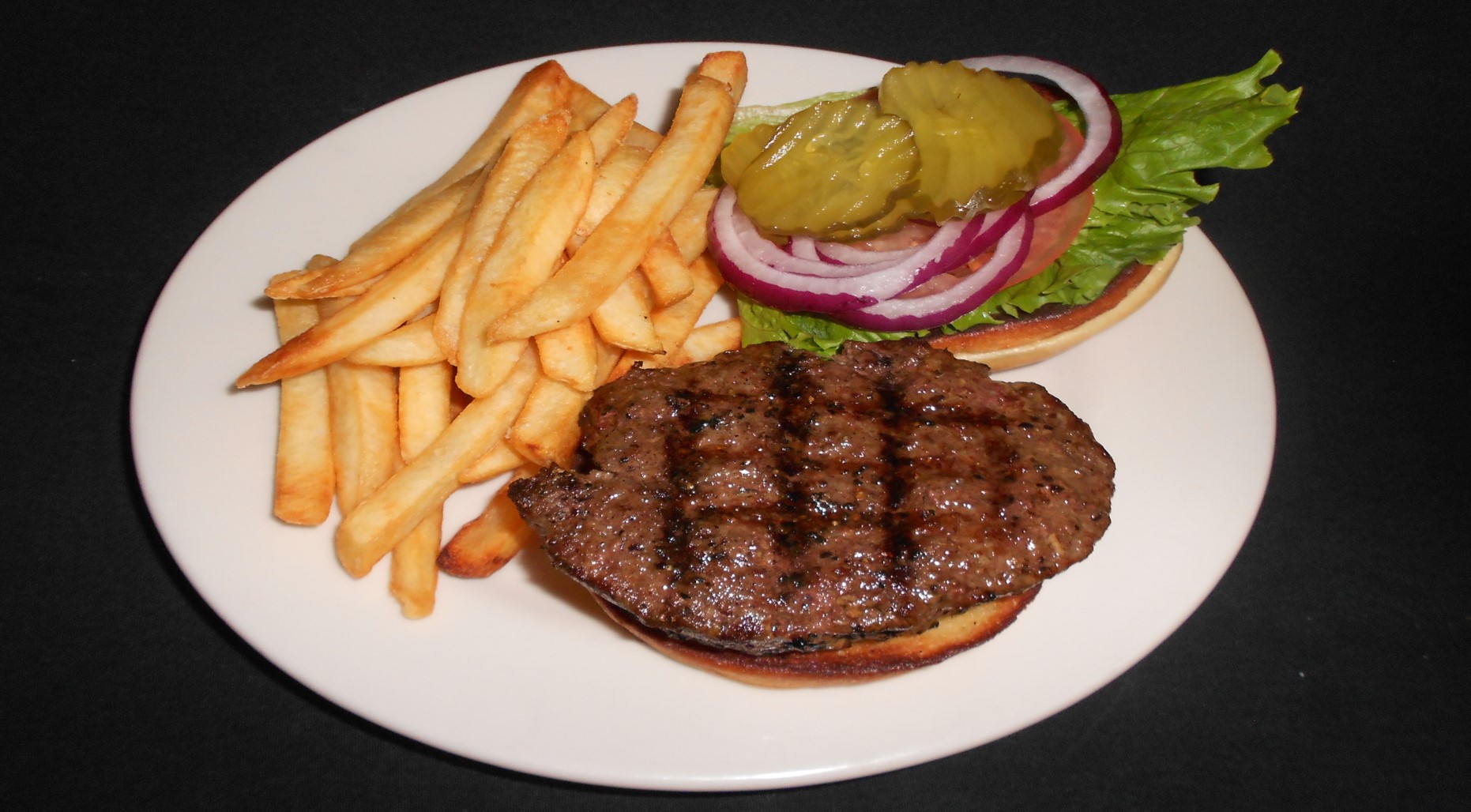 Father and child high-fiving on the golf course