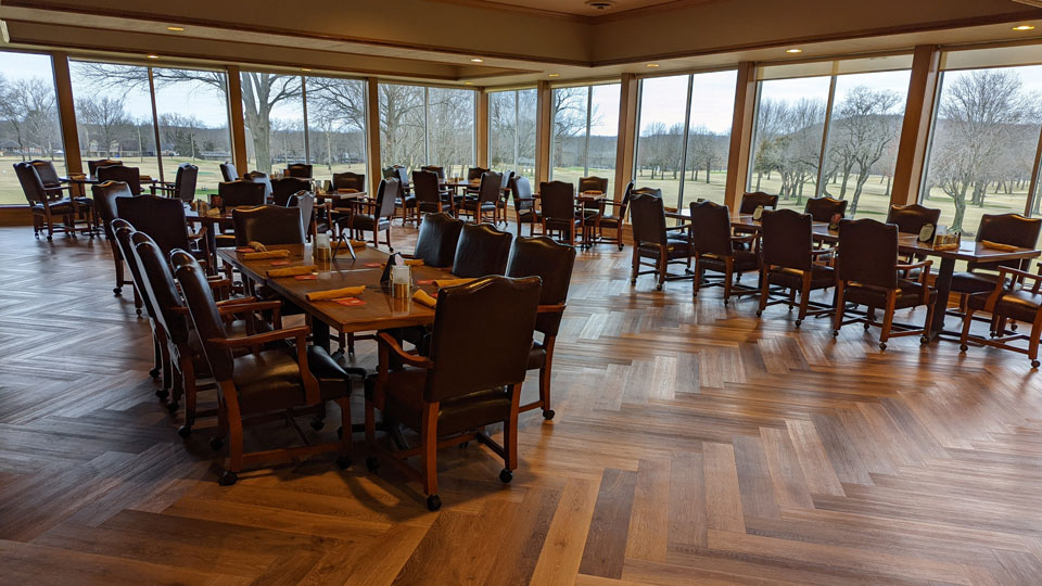 Father and child high-fiving on the golf course