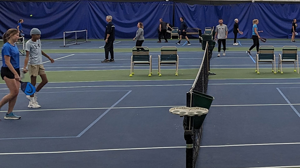 Father and child high-fiving on the golf course