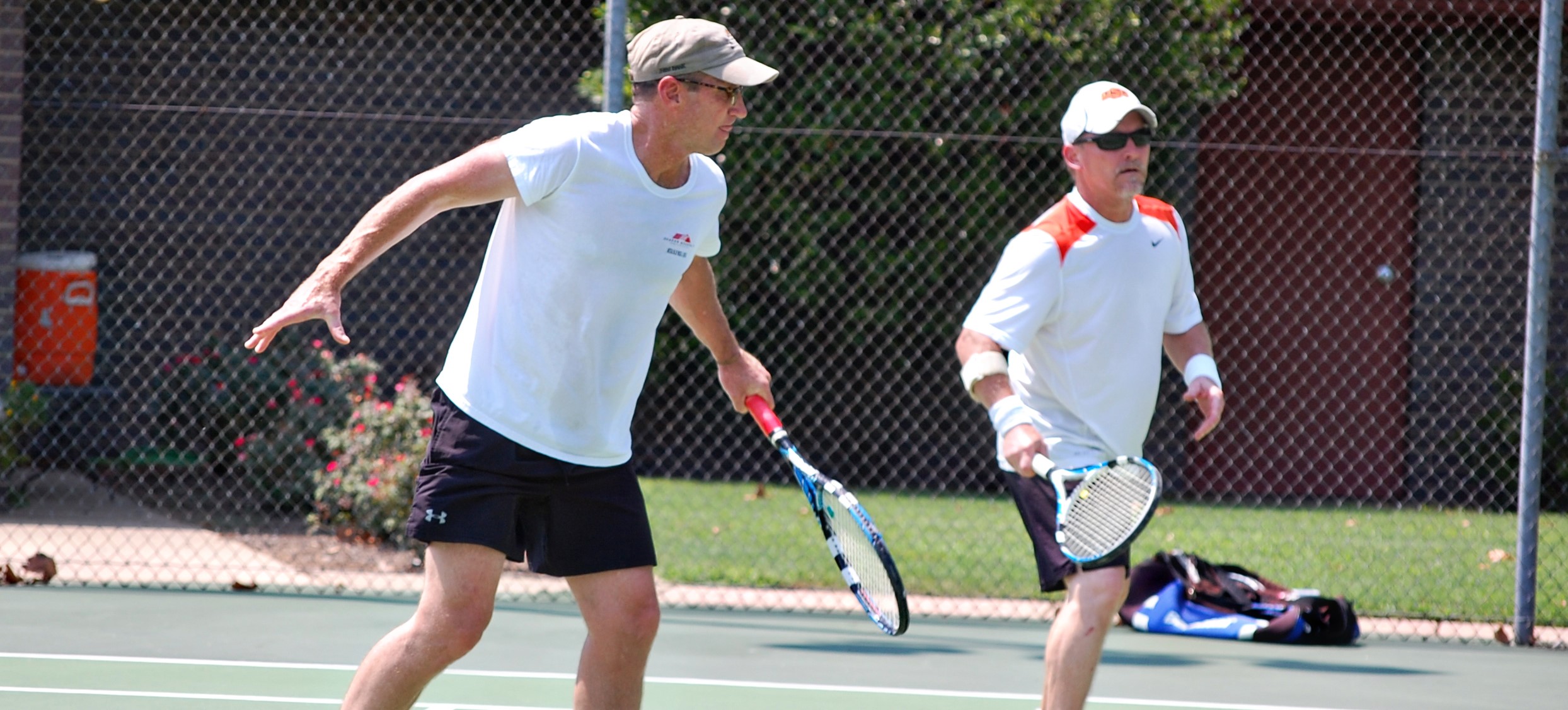 Father and child high-fiving on the golf course