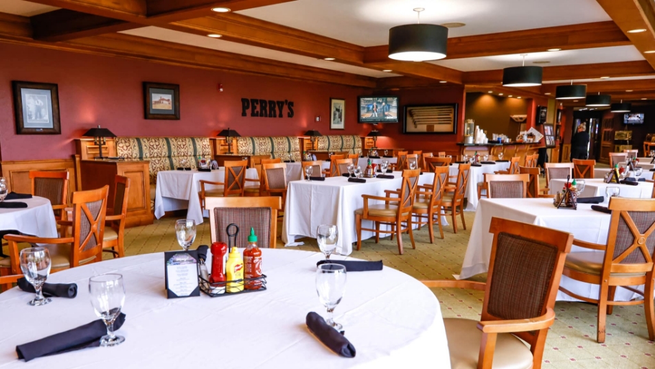 Father and child high-fiving on the golf course