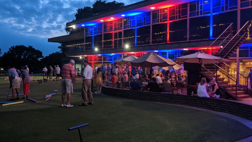 Father and child high-fiving on the golf course
