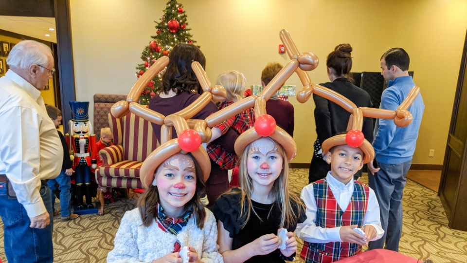 Father and child high-fiving on the golf course