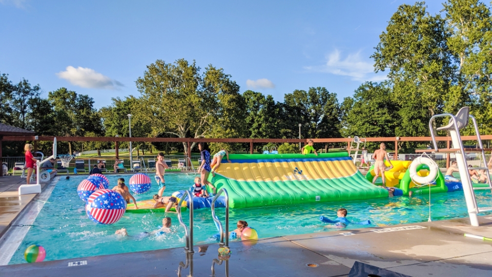 Father and child high-fiving on the golf course