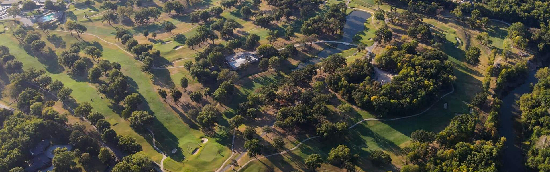 Father and child high-fiving on the golf course