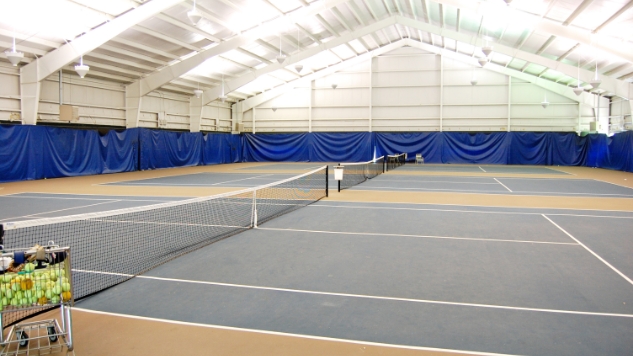 Father and child high-fiving on the golf course