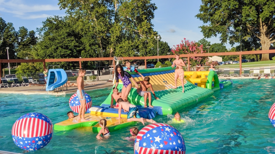 Father and child high-fiving on the golf course