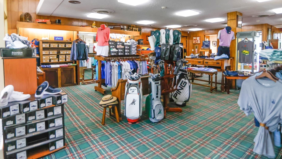 Father and child high-fiving on the golf course