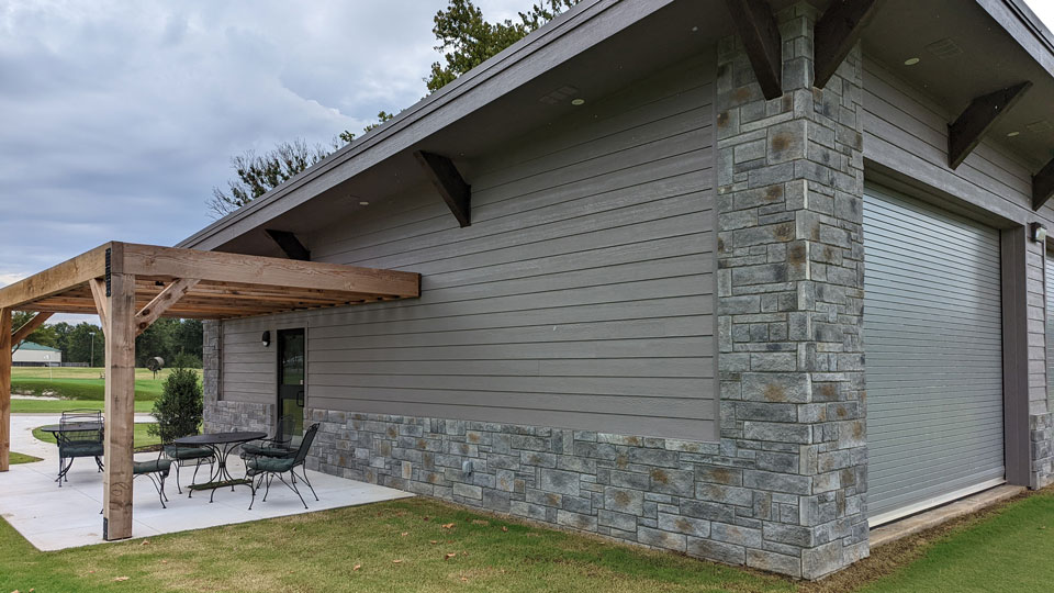 Father and child high-fiving on the golf course
