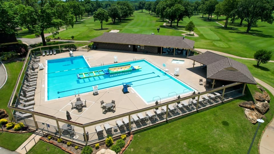 Father and child high-fiving on the golf course