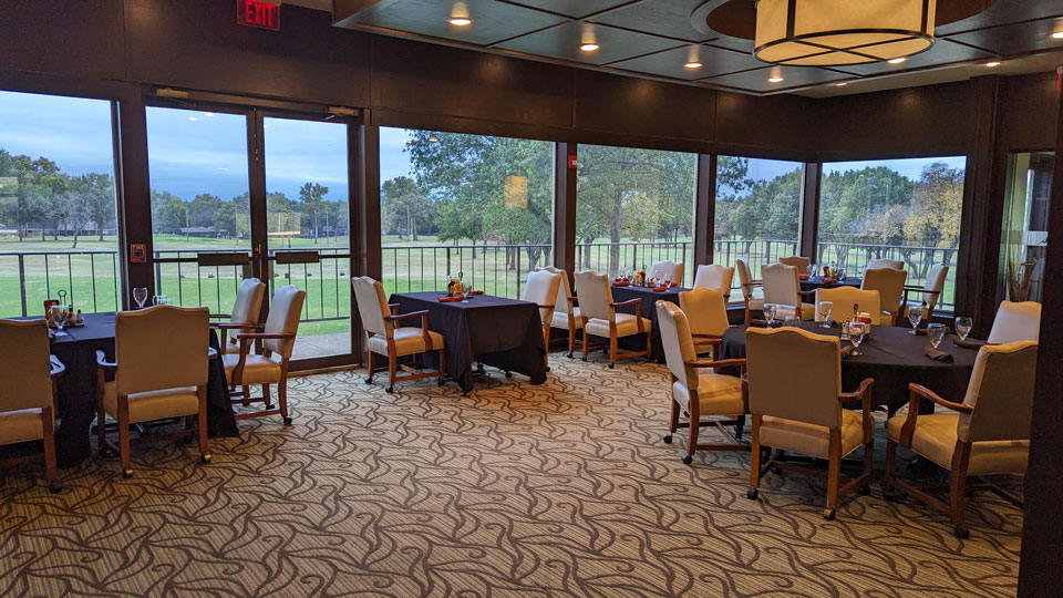 Father and child high-fiving on the golf course